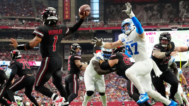 Detroit Lions defensive end Aidan Hutchinson (97) applies pressure to Arizona Cardinals...
