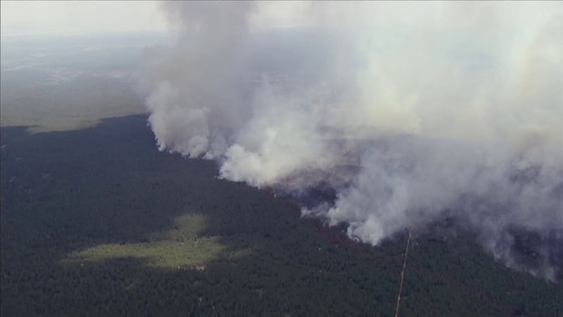 Officials say the smoke, which is visible from space, is expected to impact areas including...