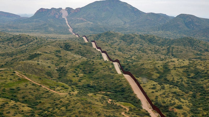 FILE - The border between the United States and Mexico, at right, cuts through the Sonoran...