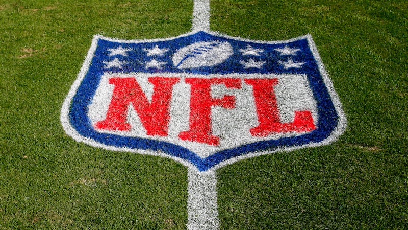 FILE - The NFL logo is displayed on the field at the Bank of American Stadium, Nov. 4, 2018,...