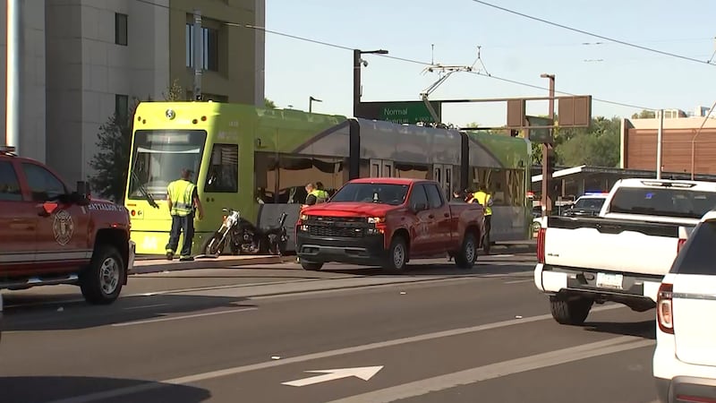 Police respond to a crash involving a motorcycle and a light rail car in Tempe.