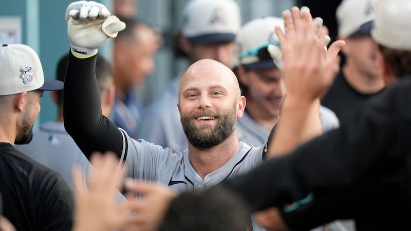 Arizona Diamondbacks' Christian Walker celebrates after his two-run home run during the third...