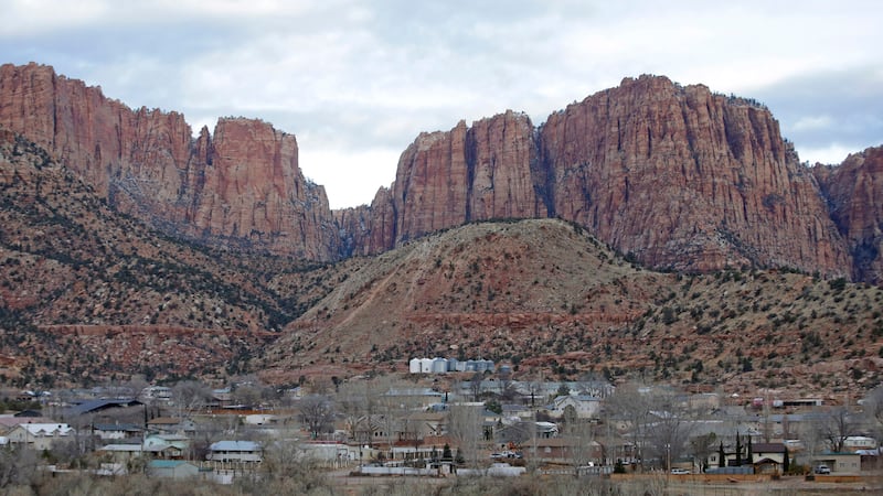 FILE - This photo shows Hildale, Utah, sitting at the base of Red Rock Cliff mountains, with...