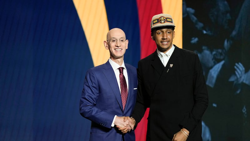 Ryan Dunn, right, poses for a photo with NBA commissioner Adam Silver after being selected...