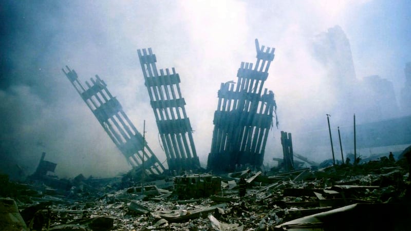 FILE - The remains of the World Trade Center stand amid other debris following the terrorist...