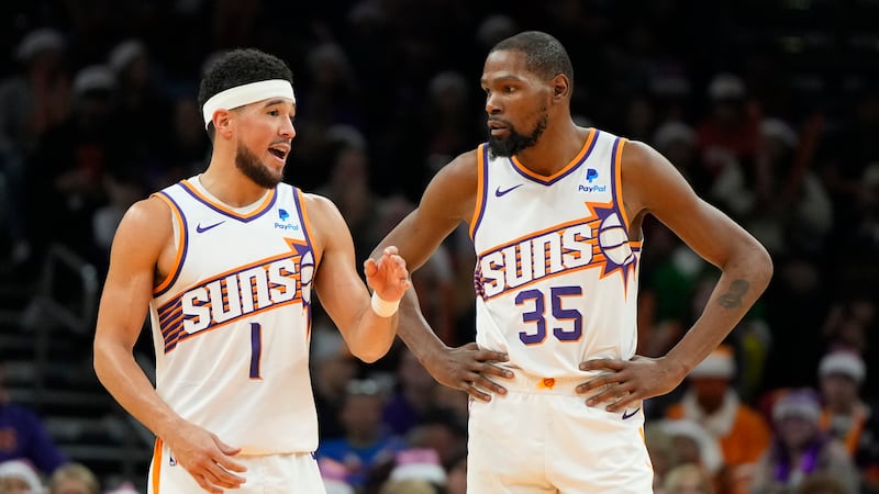 Phoenix Suns guard Devin Booker (1) and forward Kevin Durant (35) during the second half of an...