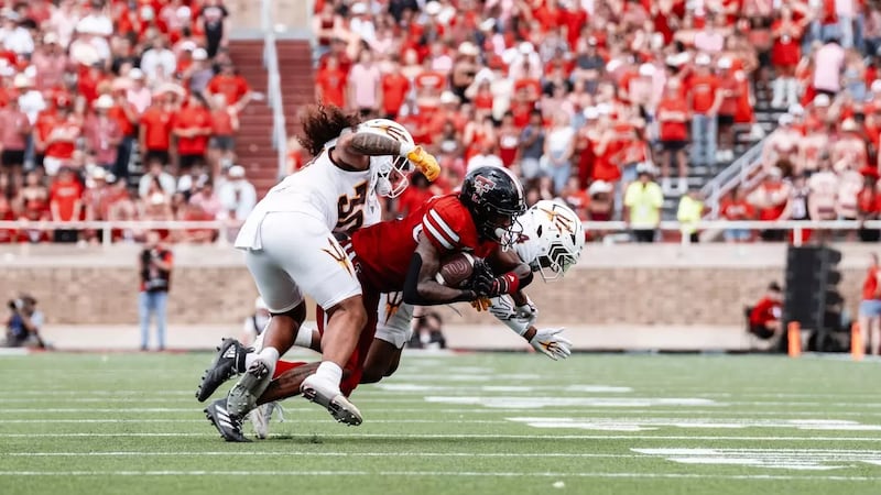 ASU defenders make a tackle against Texas Tech