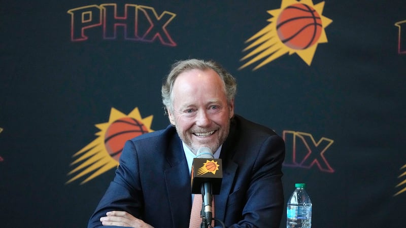 New Phoenix Suns head coach Mike Budenholzer istens to a question during an NBA basketball...