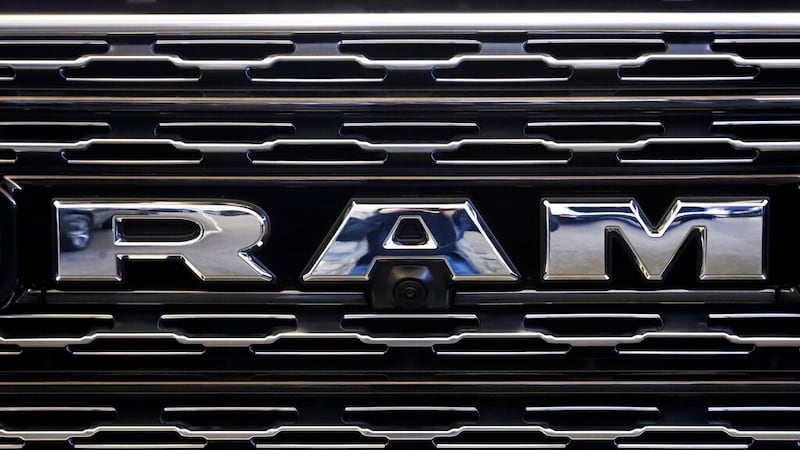 FILE - This Feb. 14, 2019, file photo shows the Ram logo on the front grill of a Ram 1500 at...
