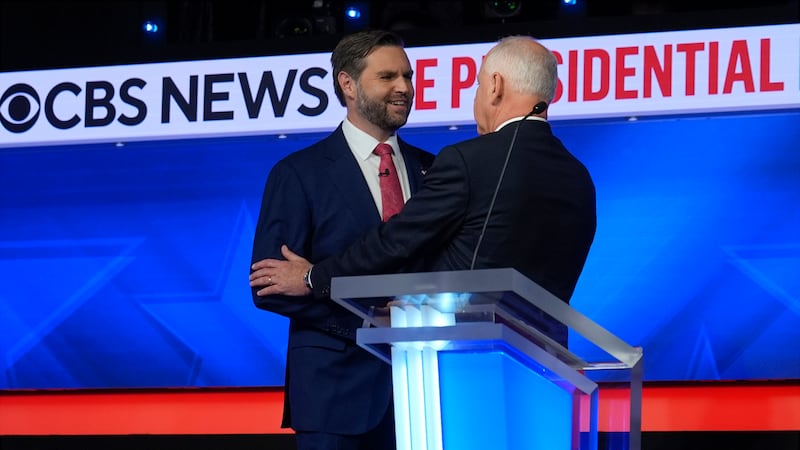 Republican vice presidential nominee Sen. JD Vance, R-Ohio, shakes hands with Democratic vice...
