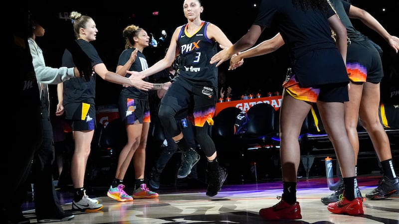 Phoenix Mercury guard Diana Taurasi (3) slaps hands with teammates during player introductions...
