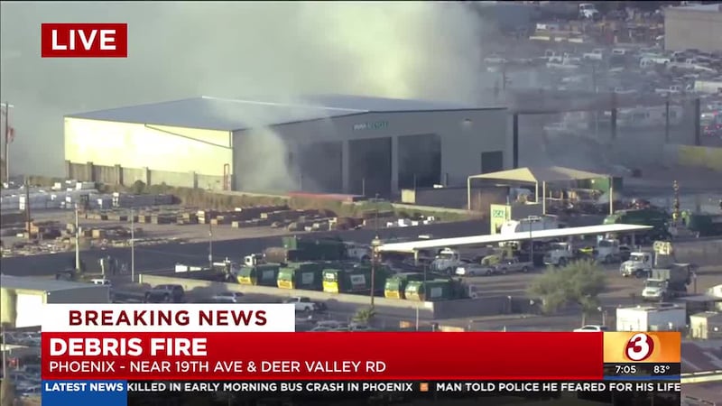 Firefighters are battling a large debris fire in north Phoenix early Tuesday morning.