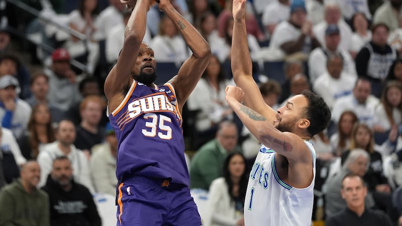 Phoenix Suns forward Kevin Durant (35) shoots over Minnesota Timberwolves forward Kyle...