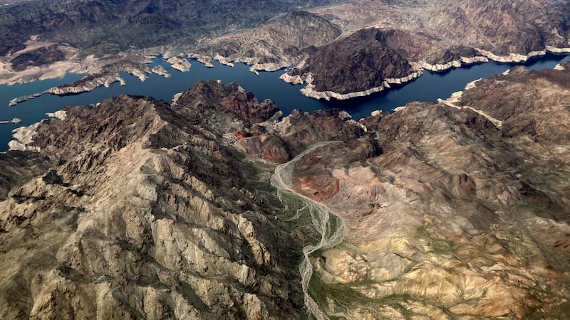 FILE - In this aerial photo, a bathtub ring of light minerals show the high water mark on the...