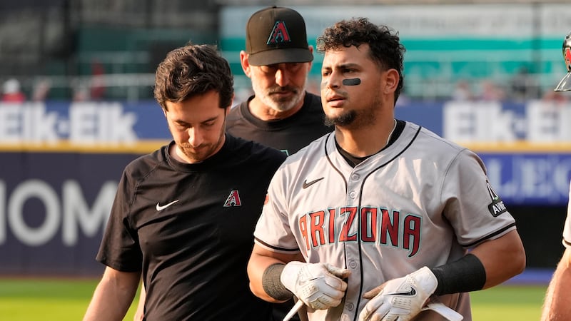 Arizona Diamondbacks' Gabriel Moreno walks off the field after an injury in the second inning...