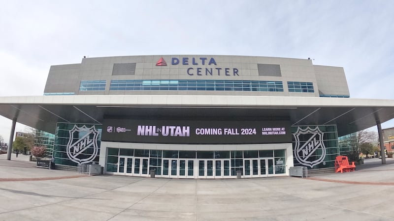 FILE - Signs celebrating the awarding of a new NHL team to Utah is displayed at the Delta...